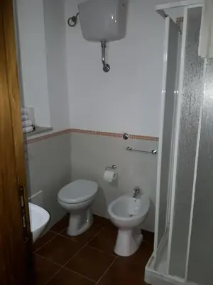 a bathroom with a toilet and a bidet at Le Tre Caravelle in Trabia