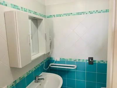 a bathroom with a sink and a mirror at Villa Ancora B&B in San Vito lo Capo