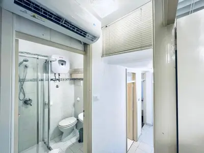 a bathroom with a toilet and a glass shower at Villino Addaura in Lido di Mondello