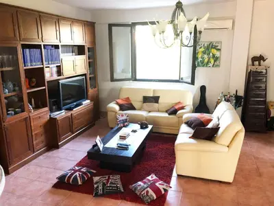 a living room with a couch and a coffee table at Stunning Sicilian Villa in Carini