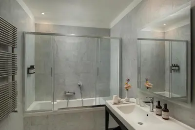 a bathroom with a shower and a sink at NH Collection Palermo Palazzo Sitano in Palermo