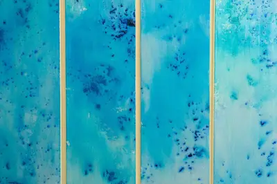 two pieces of blue painting with yellow lines at Casa Relax Mondello in Mondello