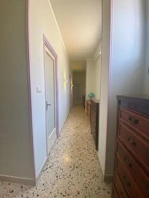 a hallway with a door leading into a room at Stella Maris in Palermo