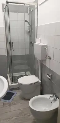 a bathroom with a shower and a toilet and a sink at Stella Maris in Palermo