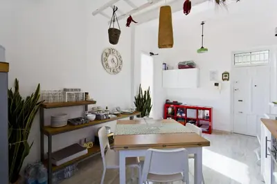 a bathroom with a sink and a shower at La terrazza del Sole B&B in Palermo