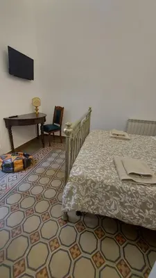 a bathroom with a shower with a blue sink at La terrazza del Sole B&B in Palermo