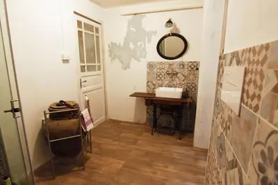 a hallway with a table and a mirror on the wall at Artisan Maison Palermo in Palermo