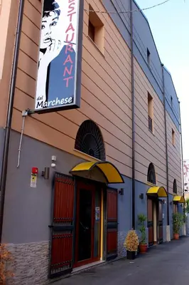 a building with a sign on the side of it at palermo casa vacanze in Palermo