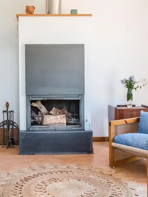 a living room with a fireplace and a couch at Calarossa Seaview by Wonderful Italy in Terrasini