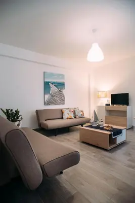 a living room with a couch and a coffee table at The Lighthouse in Trappeto