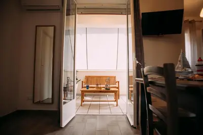 a room with a table in the middle of a room at The Lighthouse in Trappeto
