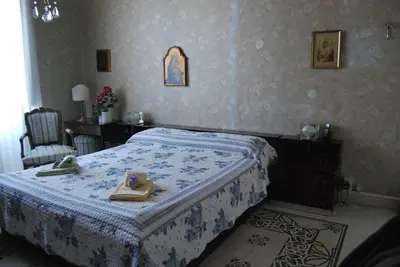 a bedroom with a bed with towels on it at 4You in Palermo