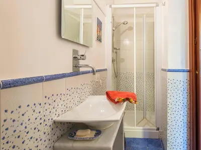 a bathroom with a sink and a shower at La Casa di Sara a Mondello by Wonderful Italy in Mondello