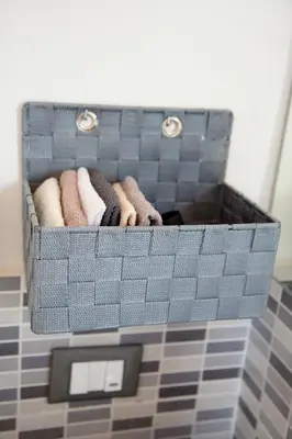 a basket of towels sitting on top of a bathroom counter at Vista Capo in Palermo