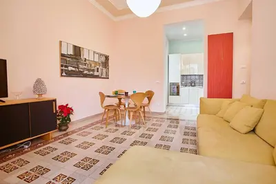 a living room with a couch and a table at KMC suites - Yellow in Palermo