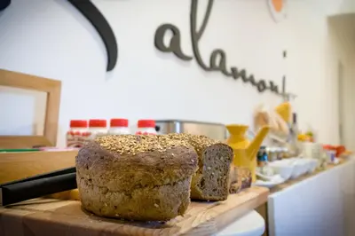 a loaf of bread sitting on top of a cutting board at Kalamonjo Suite&Rooms in Palermo