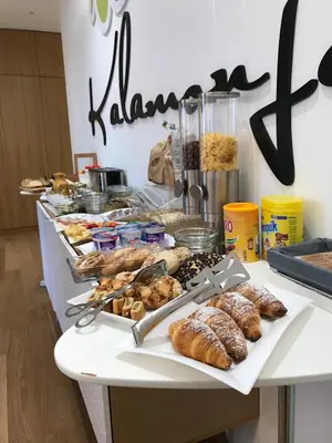 a buffet with many different types of food on a table at Kalamonjo Suite&Rooms in Palermo