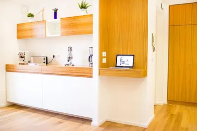 a kitchen with a counter with a laptop on it at Kalamonjo Suite&Rooms in Palermo