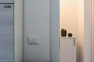 a white door with a cactus on top of it at Casa Francesco in San Vito lo Capo