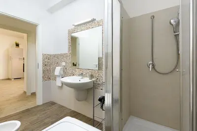 a bathroom with a sink and a shower at Casa Francesco in San Vito lo Capo