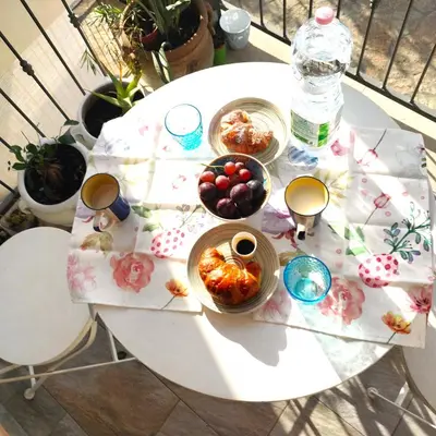 a white table with bowls of food on it at Appartamento Le Ginestre in San Vito lo Capo
