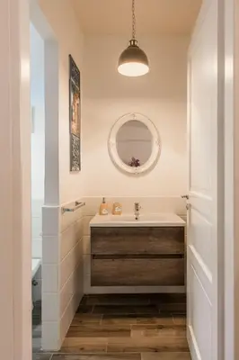 a bathroom with a sink and a mirror at Villa Cinzia-150 mt from the beach in Mondello