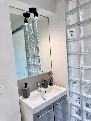 a bathroom with a sink and a mirror at Capo Loft in Palermo