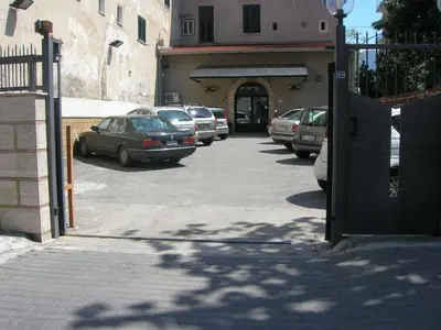 a bunch of cars parked in a parking lot at Hotel Villa Archirafi in Palermo