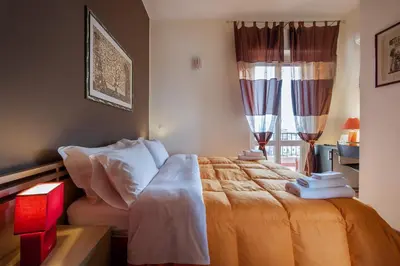 a bedroom with a bed with towels on it at Sky Sleeping in Palermo