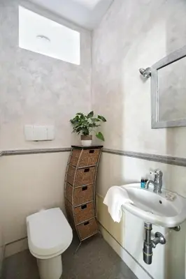 a bathroom with a toilet and a sink at Al Massimo Piacere in Palermo