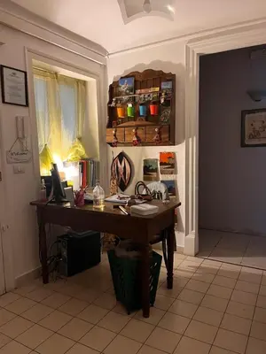 an office with a desk with a computer on it at Nuovo Cortile Palermo Bed and Breakfast in Palermo