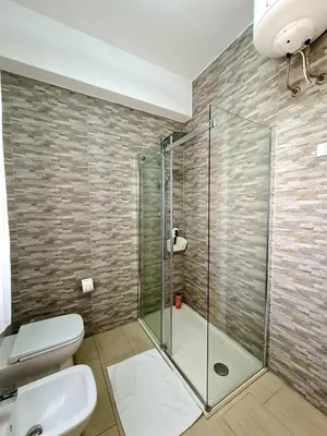 a bathroom with a glass shower and a toilet at Casa Vacanze Sea-Life in Alcamo Marina