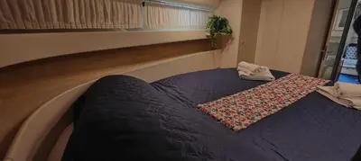 a bed with a blanket on top of it at Desirè Charming House Boat in Palermo