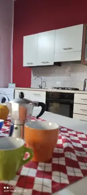 a kitchen with two cups on a table at Casa Samu in Palermo