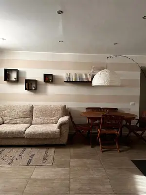 a living room with a couch and a table at Marilù in Palermo