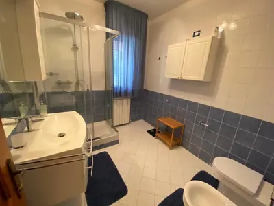 a bathroom with a sink and a shower and a toilet at Villa Rosada in Castellammare del Golfo
