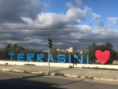 a sign that says ferris island with a red heart at By the Sea in Terrasini