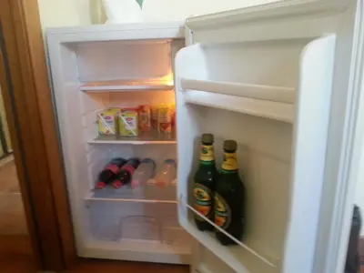 an open refrigerator with two bottles of beer at Bed & Breakfast Sweet Politeama in Palermo