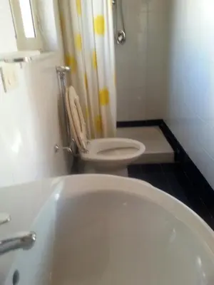 a bathroom with a white tub and a toilet at Bed & Breakfast Sweet Politeama in Palermo