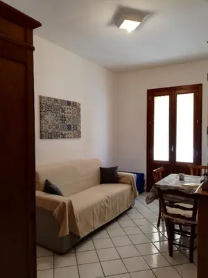 a living room with a couch and a table at Casa Marcella San Vito Lo Capo in San Vito lo Capo