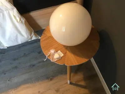 a white balloon sitting on a table next to a bed at GiuiuzzaMia in Palermo