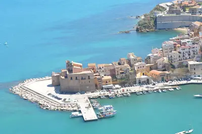 an aerial view of a harbor with boats in the water at Alice's Apartment in Castellammare del Golfo