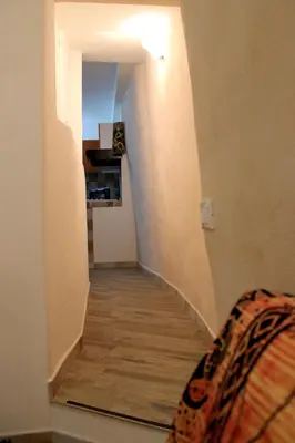 a hallway with a stairway in a house at Camerini di Santa Cecilia in Palermo