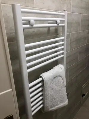 a towel rack in a bathroom with a towel at Ashur apartments in Mondello