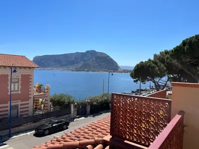 a view of a large body of water from a building at Ashur apartments in Mondello