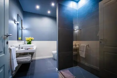 a bathroom with a shower and a sink and a toilet at BB 22 Charming Rooms & Apartments in Palermo