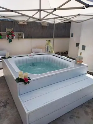 a large hot tub in a room at Villa Eco-Chic in Carini