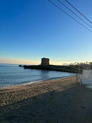 a beach with an island in the water at Villa Eco-Chic in Carini
