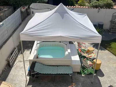 a white tent with a bed and chairs under it at Villa Eco-Chic in Carini