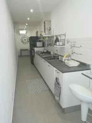 a large kitchen with a sink and a sink at Villa Eco-Chic in Carini